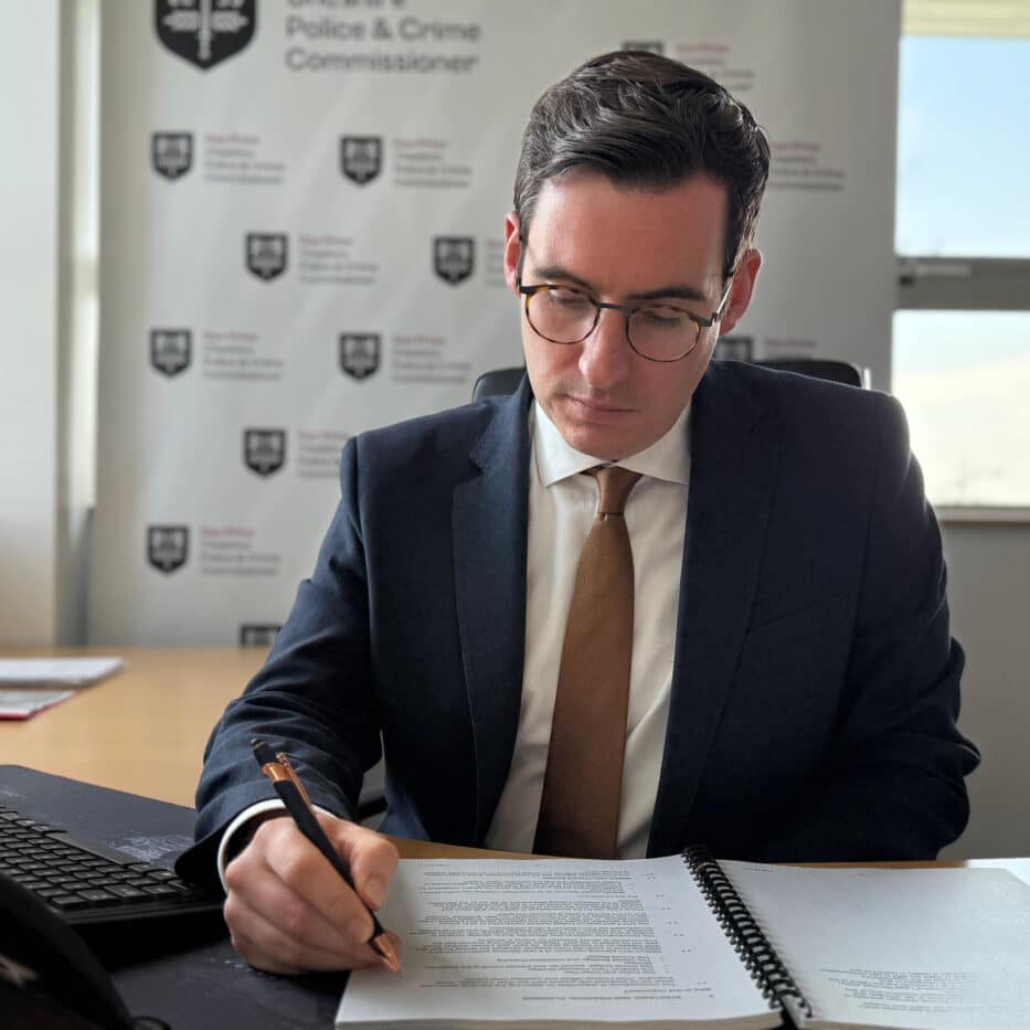 Dan Price sitting at a desk