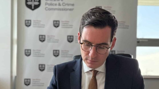 Dan Price sitting at a desk