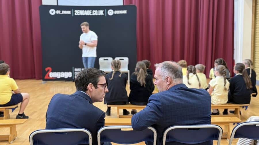 Dan Price sat with Head Teacher at Halton Lodge primary school