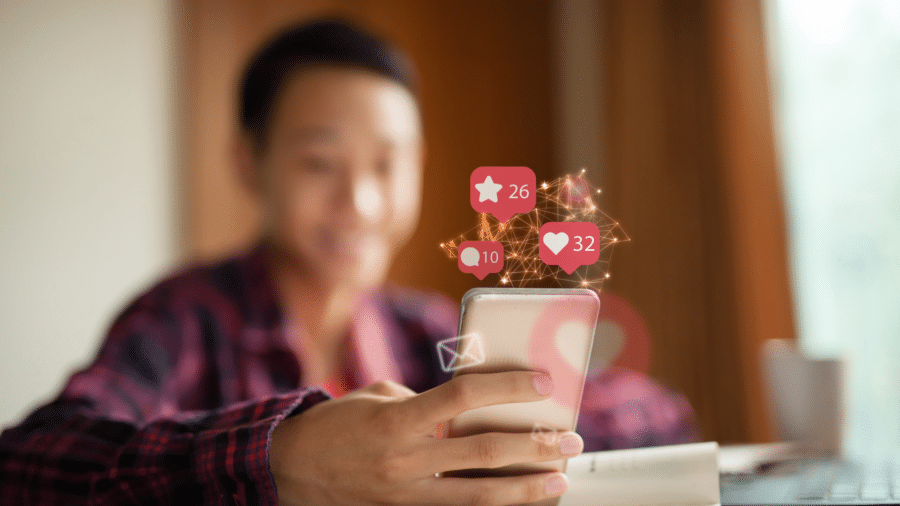 Young person on smart phone looking at apps