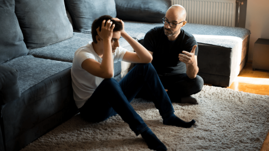 Young person getting support from an older man