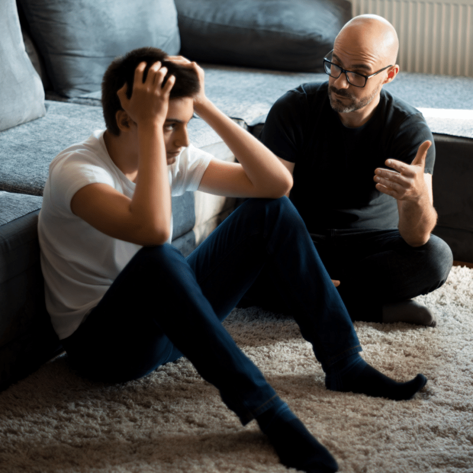 Young person getting support from an older man
