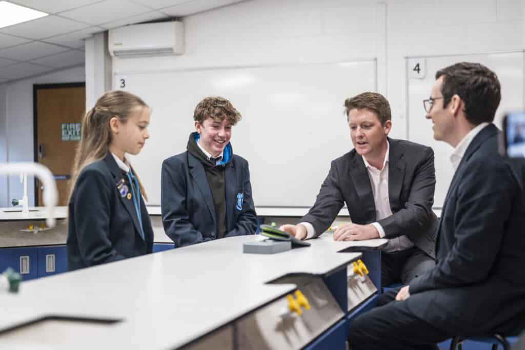Duke of Westminster with Dan Price and students