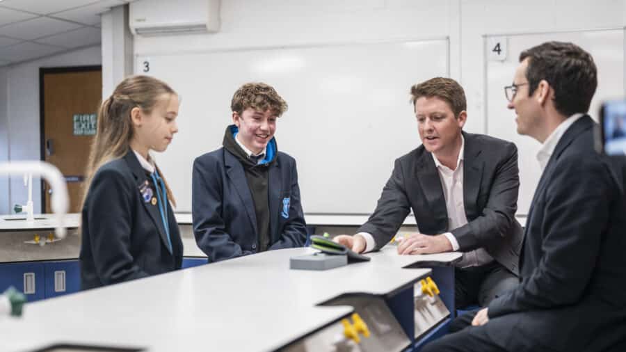 Duke of Westminster with Dan Price and students