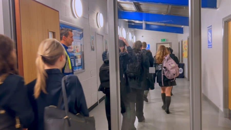 Children walking down a school corridor